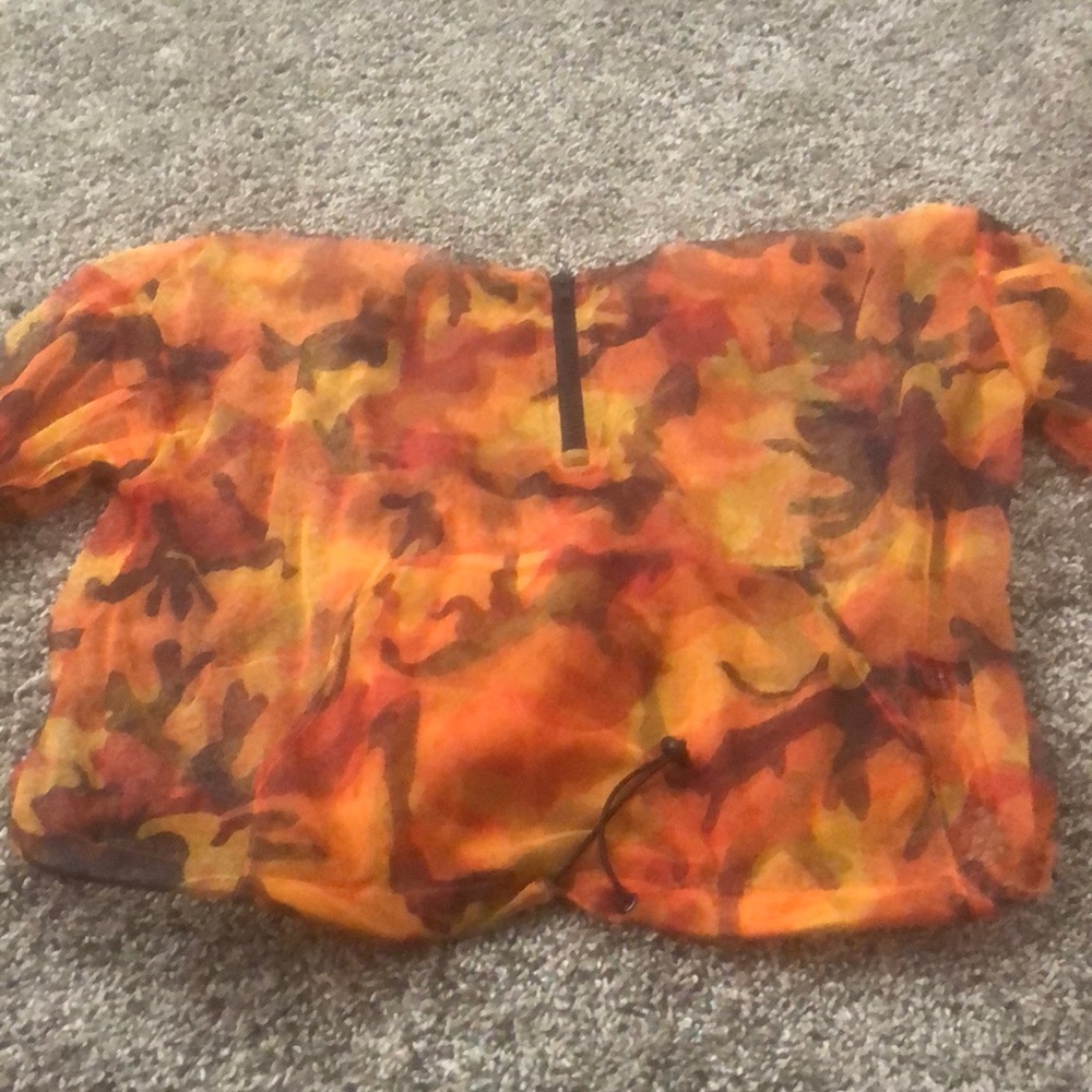 A sheer black and orange camo hood shirt